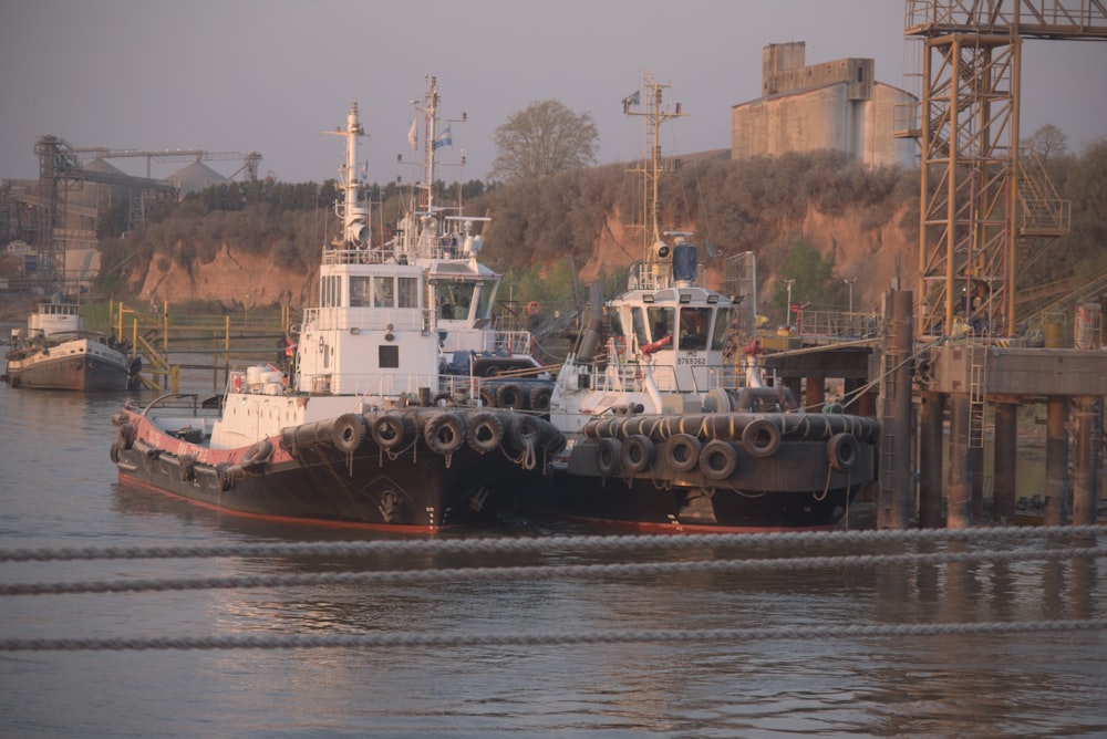 a couple of boats that are sitting in the water