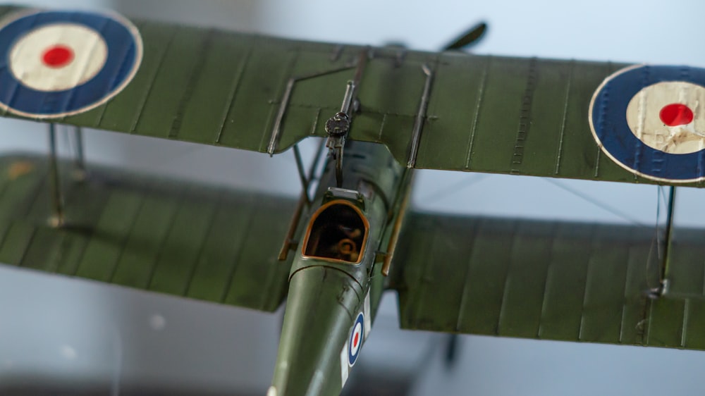 a close up of a small green airplane