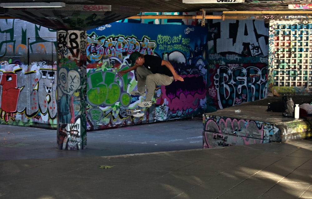 a man riding a skateboard up the side of a ramp