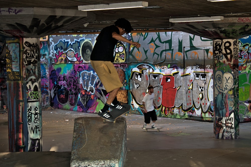 a man riding a skateboard up the side of a ramp