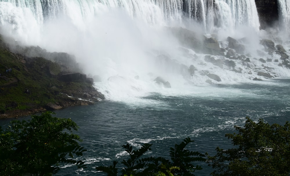 a large waterfall with water pouring out of it