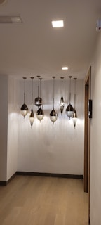 Spacious hallway with smooth plaster walls and elegant lighting design