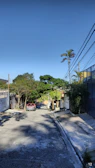 A quiet street lined with houses in a peaceful neighborhood.