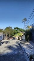 A scenic view of a residential neighborhood with houses lined along a quiet street.