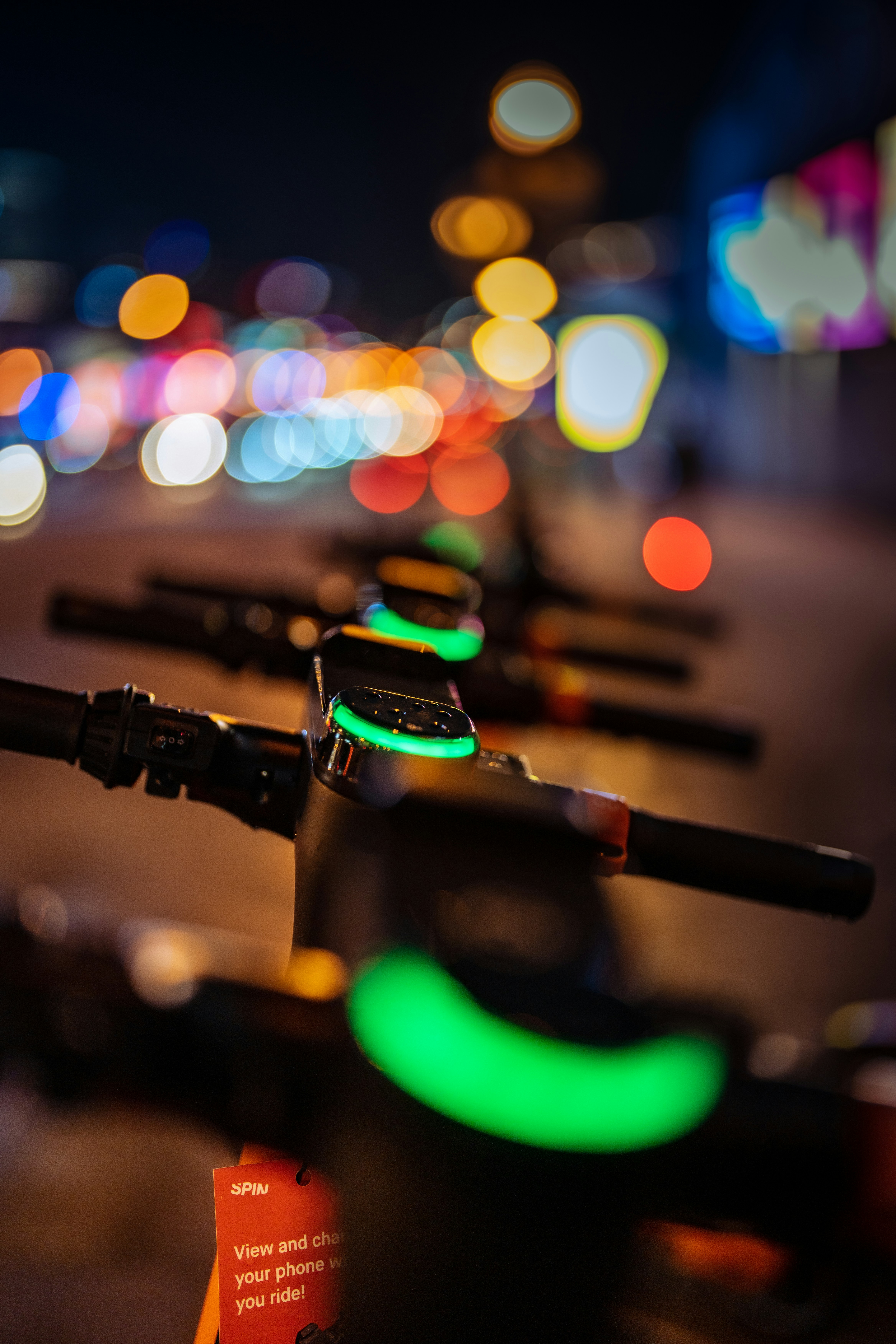 a row of bikes parked on the side of a road