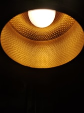 Close-up 3D visualization of a sleek modern lamp showcasing texture and lighting.