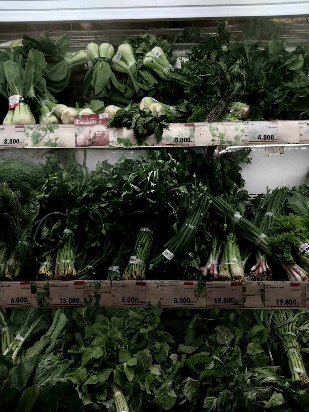 a grocery store filled with lots of veggies