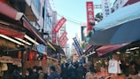 A bustling local market in Japan with vibrant stalls.