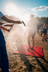 A misting fan cooling an outdoor event in Banda Aceh under bright sunlight.