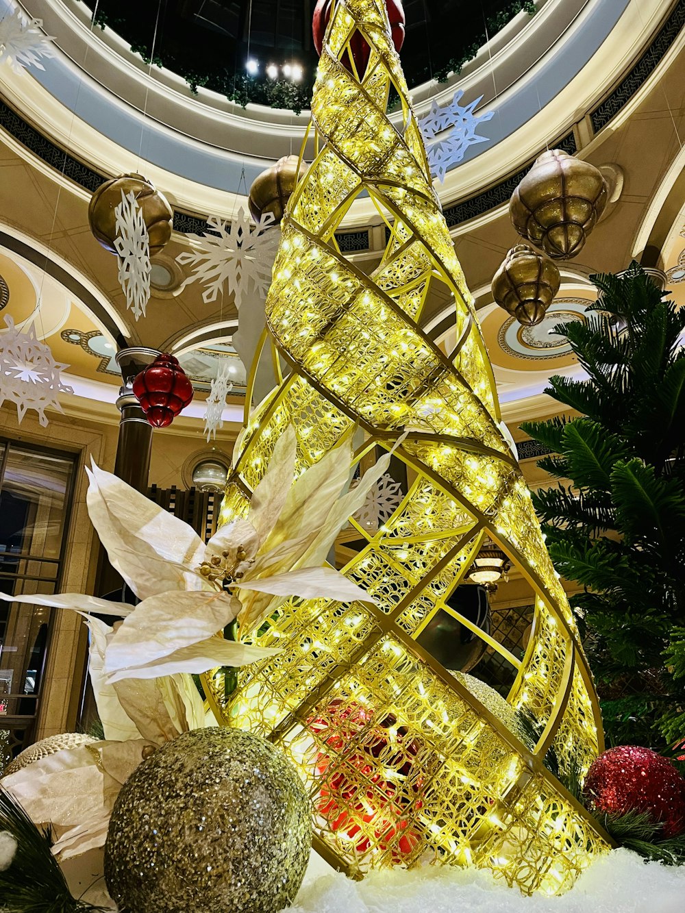a lighted christmas tree in a shopping mall