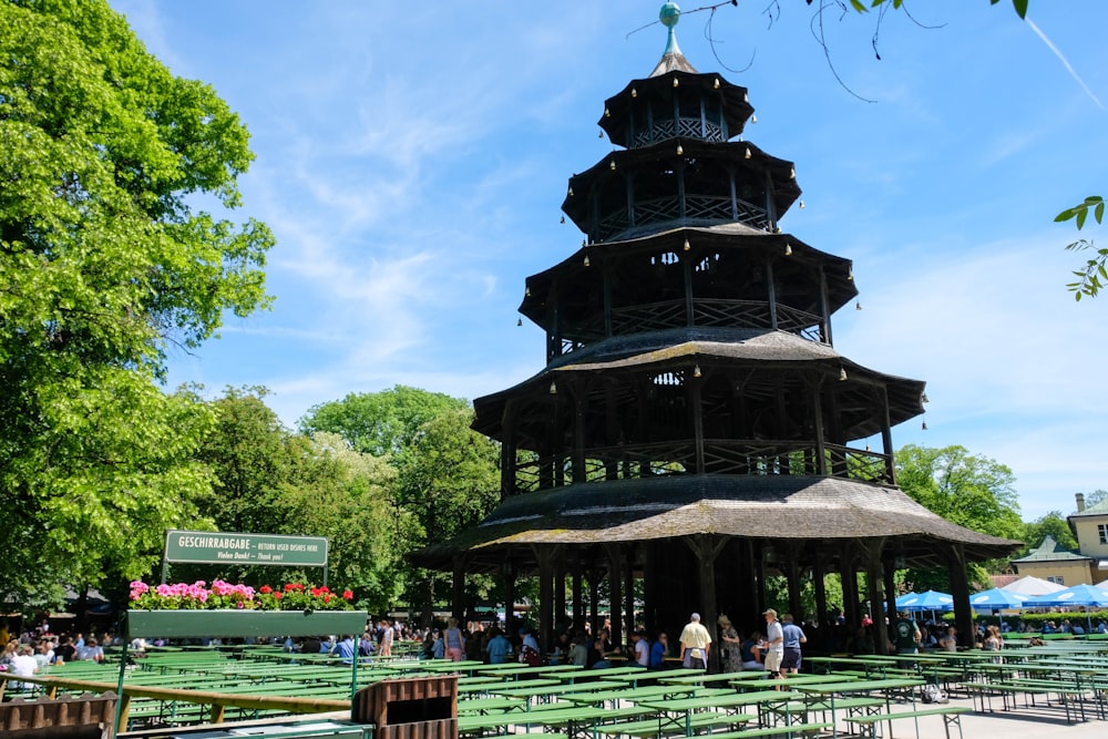 a tall tower with a bunch of tables in front of it