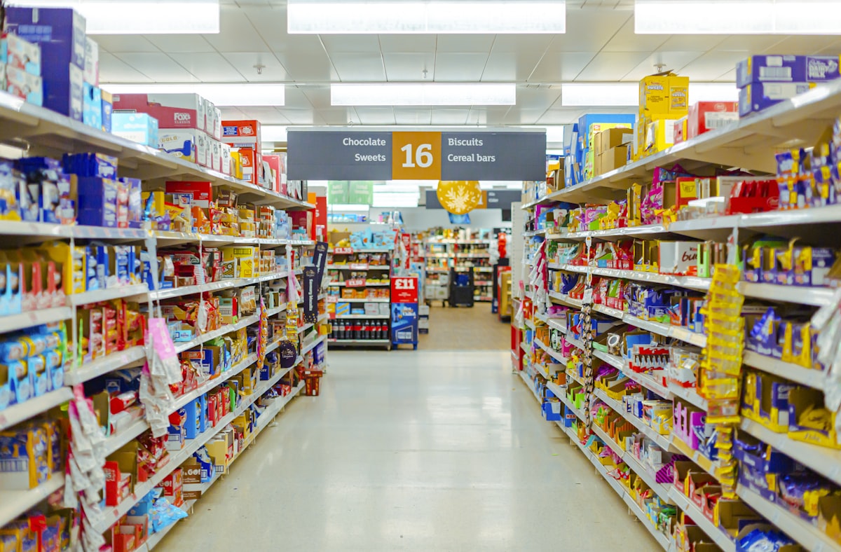 Supermarket aisle filled with products on shelves