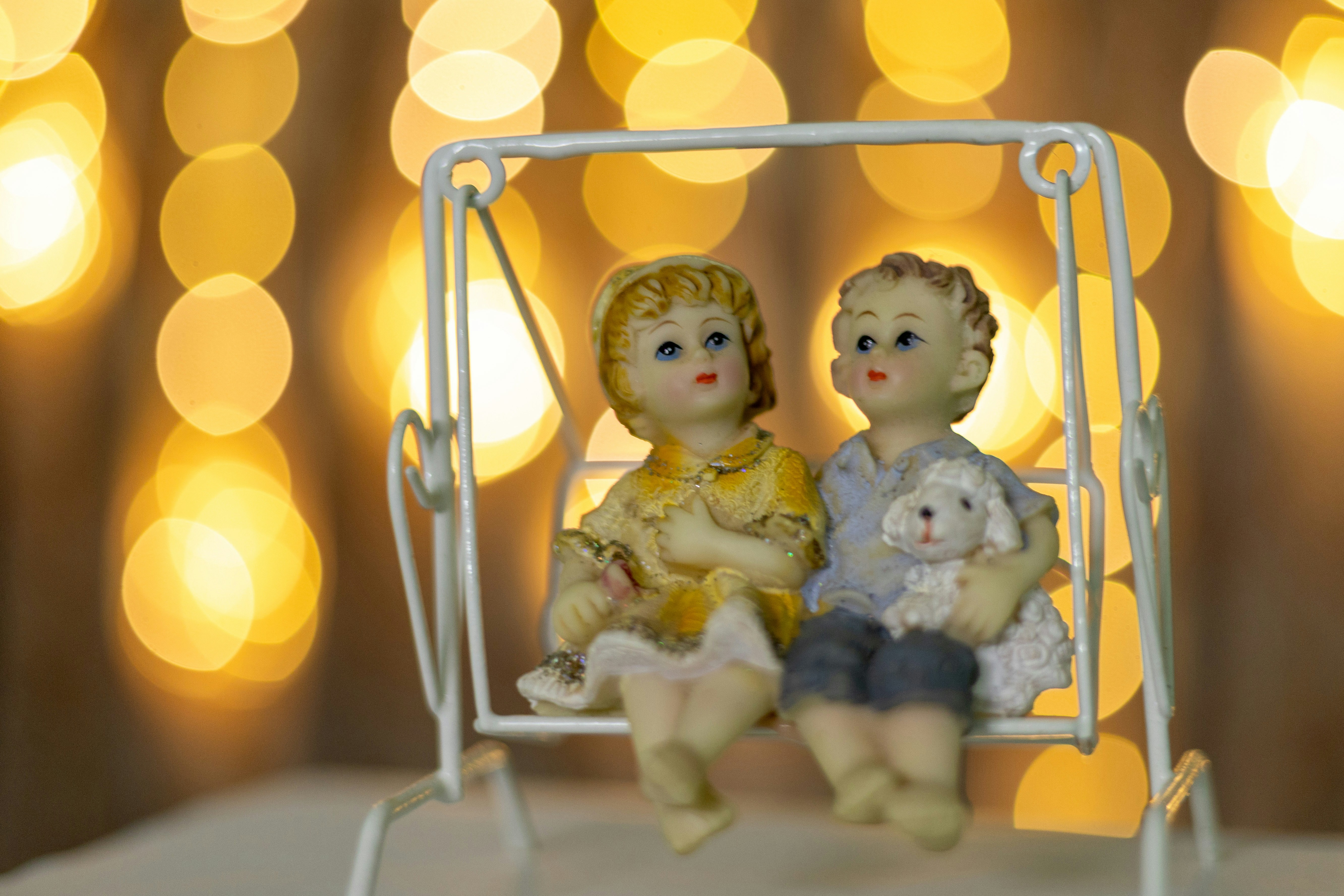 a couple of figurines sitting on top of a table