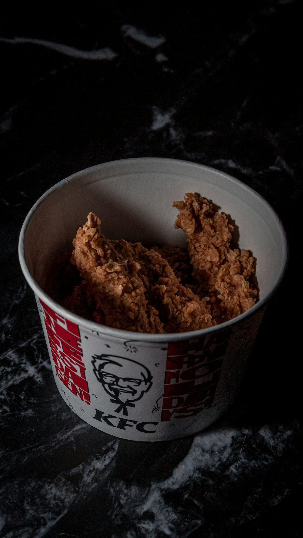 a bowl filled with fried food on top of a table