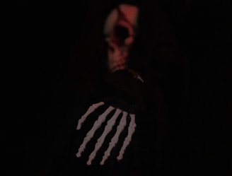 A haunting still of Freddy Krueger emerging from the shadows with his iconic glove.