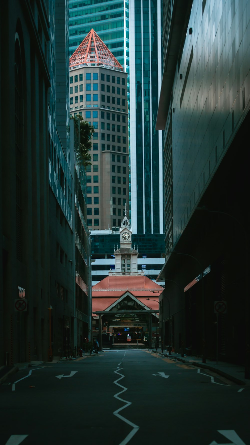 a city street with a clock tower in the distance