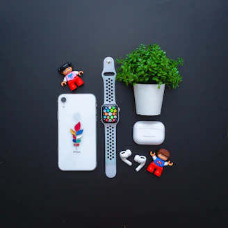 A neatly arranged flat lay of colorful phone and charging accessories on a clean white surface.