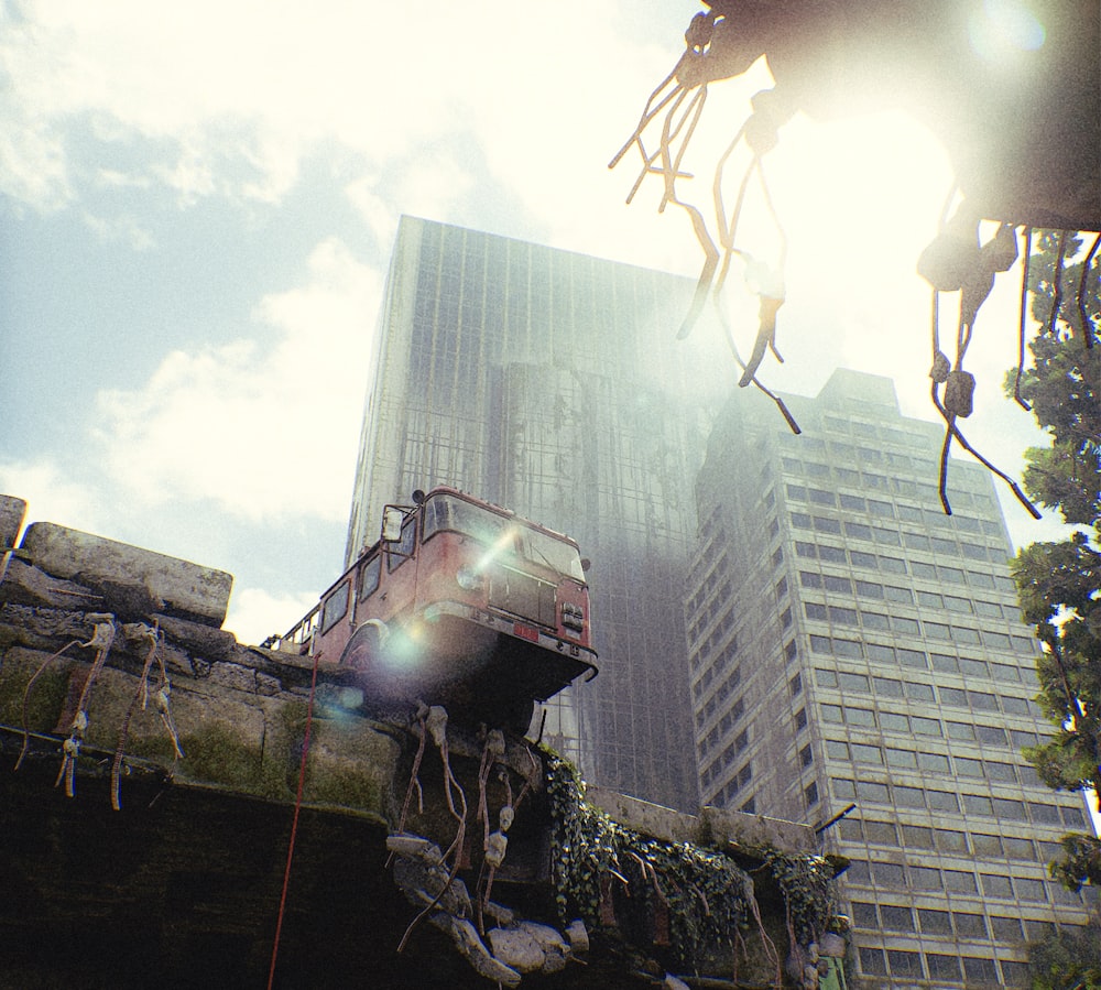 a train on a track in front of a tall building