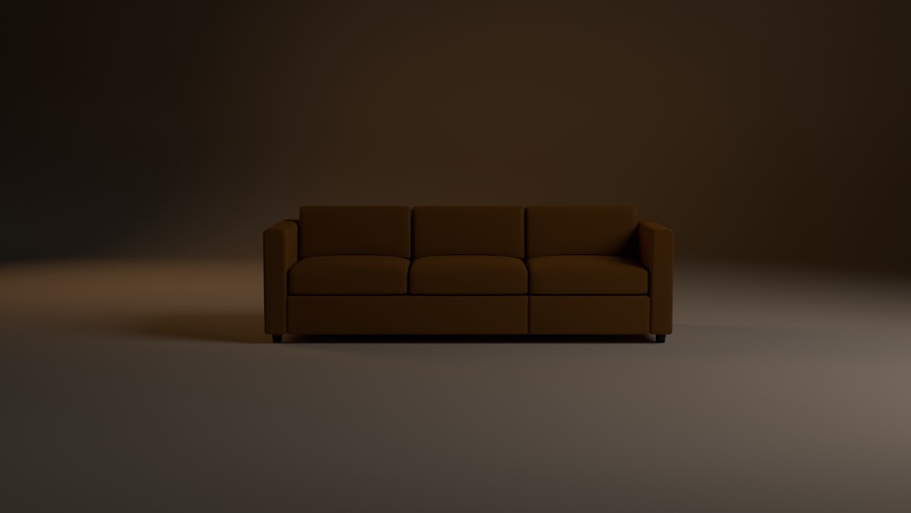 a brown couch sitting in the middle of a room