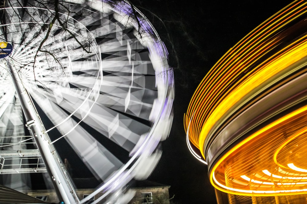 a ferris wheel and a ferris wheel at night