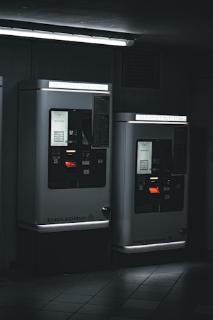 A friendly parking enforcement officer assisting a driver with ticket information on a sunny city street.