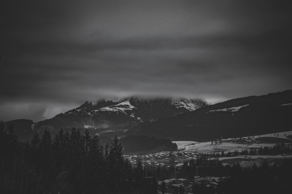 a black and white photo of a mountain range