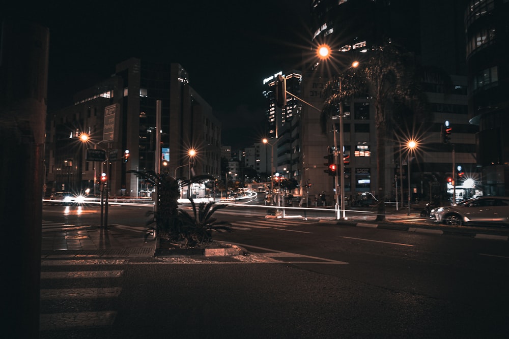 a city street at night with a lot of traffic