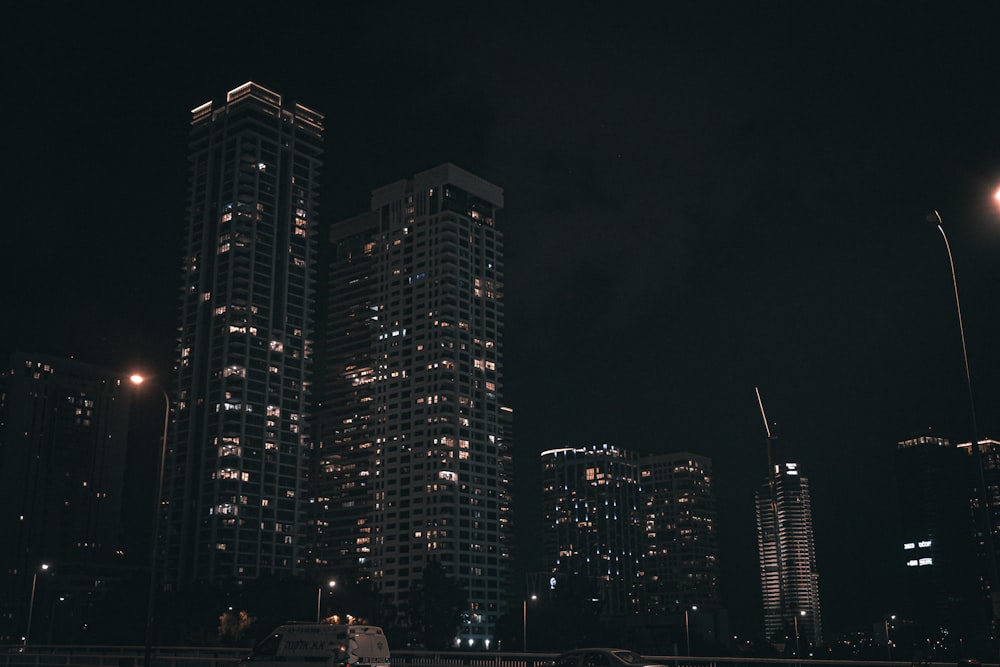 a city at night with a lot of tall buildings