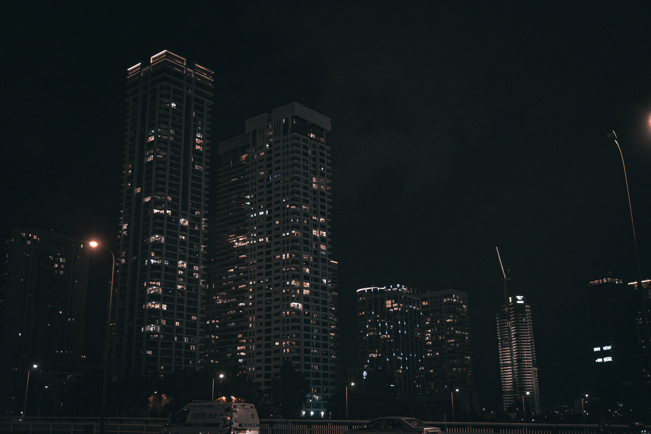 Tel Aviv skyline at night with the Sarona Towers and the Mediterranean horizon