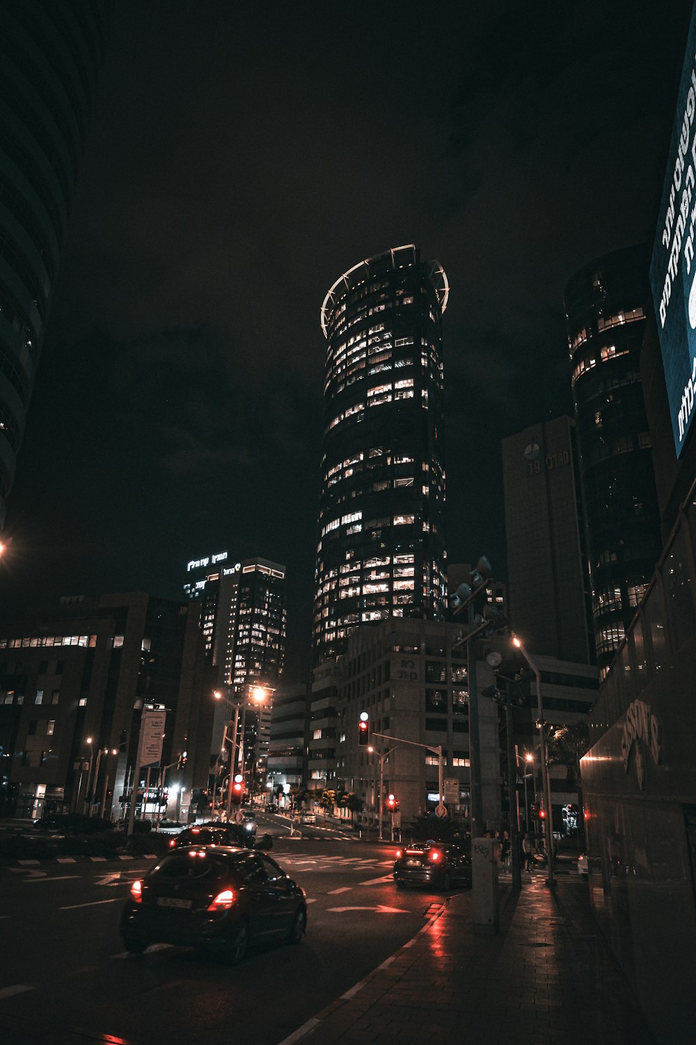 a city street at night with a lot of traffic