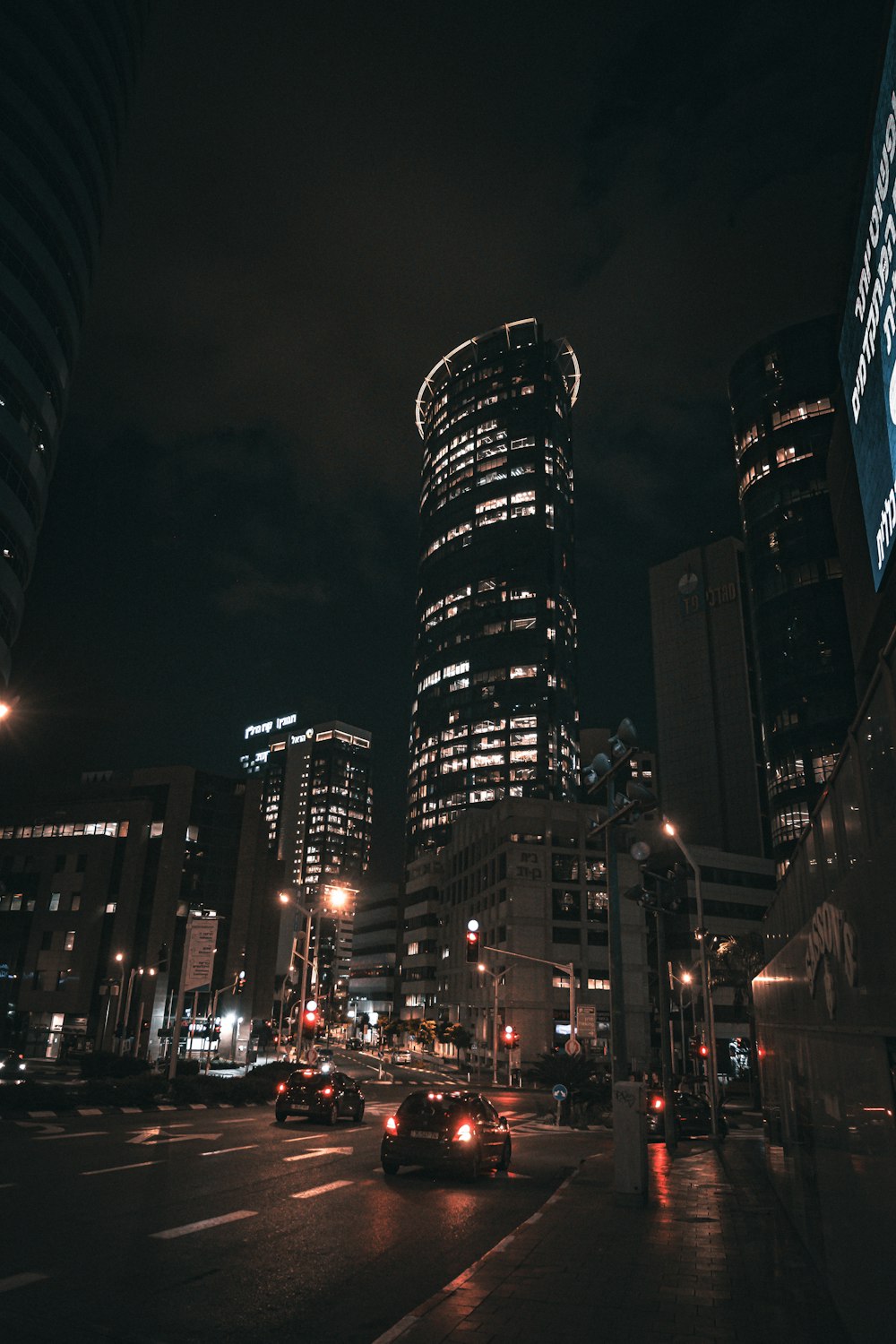 a city street at night with a lot of traffic