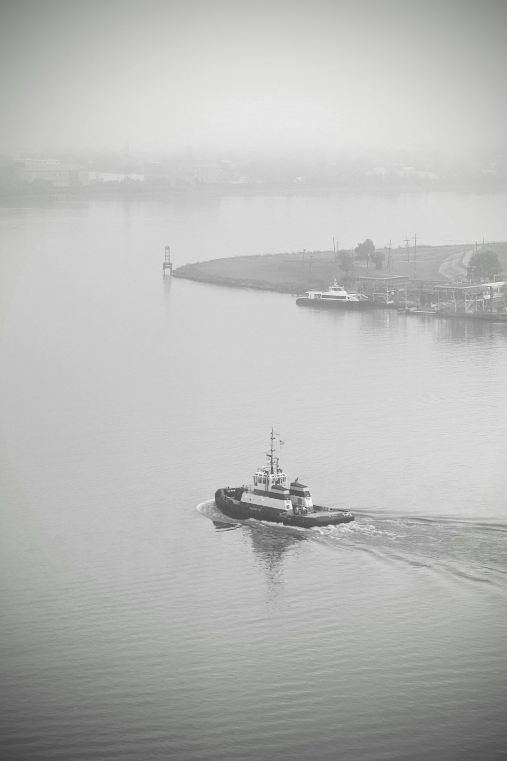 a small boat in a large body of water