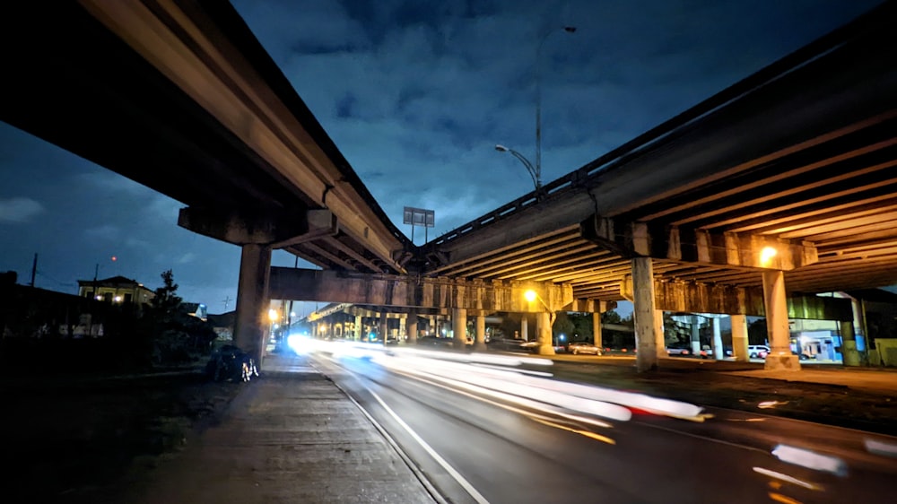 a long exposure shot of a highway at night