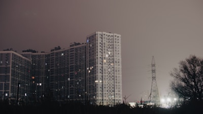 Night view of a high-rise residential building in the city.