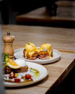 two plates of food sitting on a table