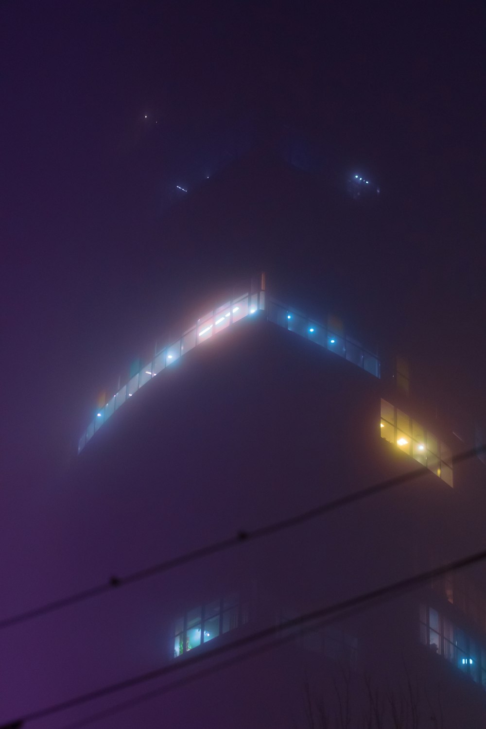 a foggy night at the top of a hill