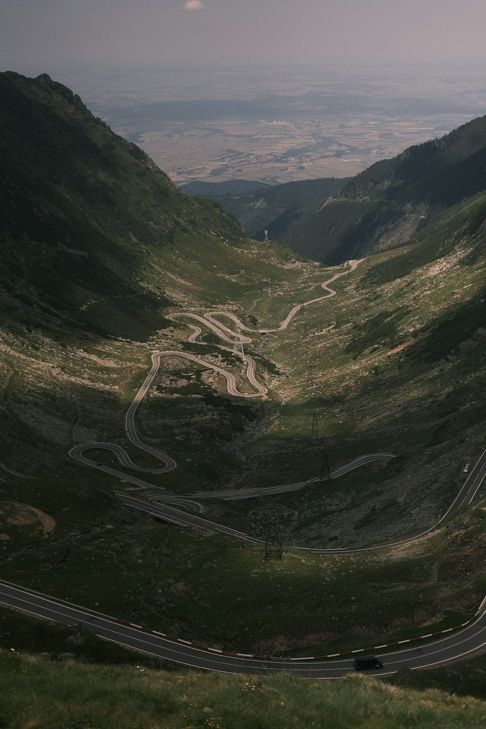 a view of a winding road in the mountains