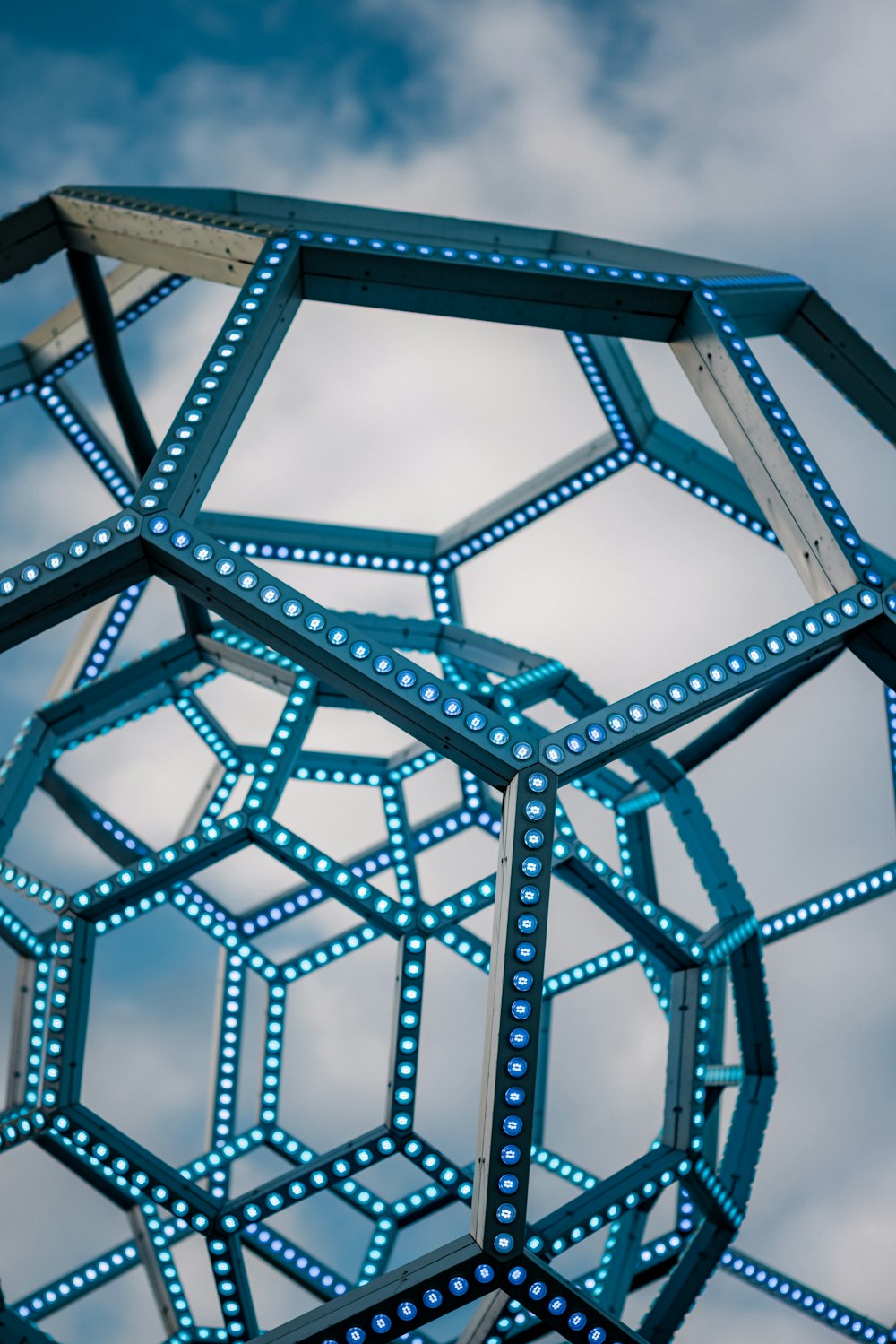 a sculpture made of hexagonal shapes with blue lights