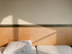 Spacious bedroom with two beds and warm lighting.