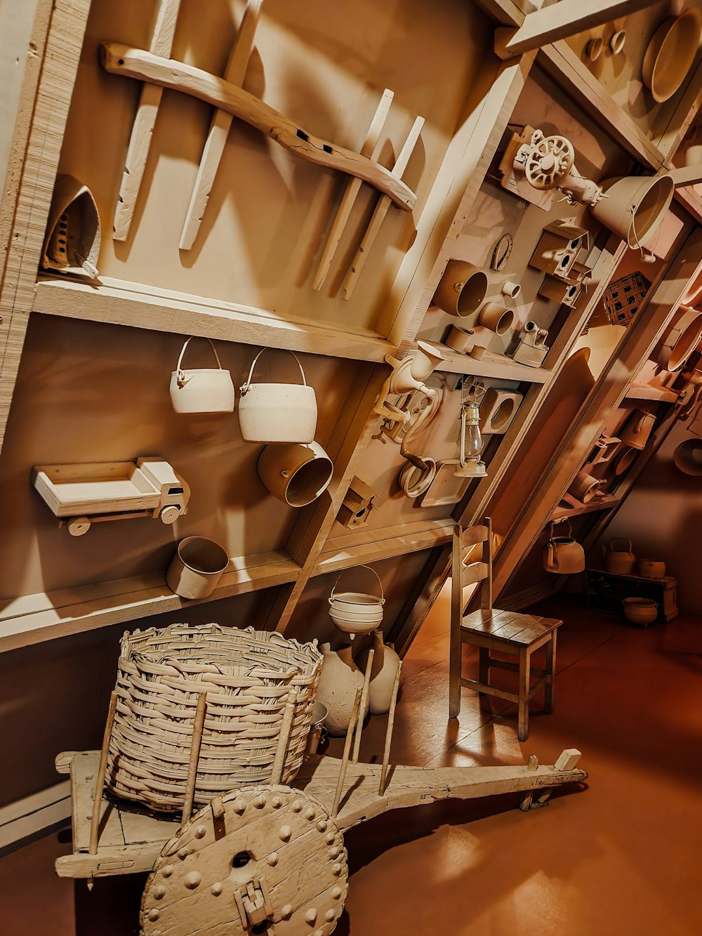 a collection of wooden objects on display in a room