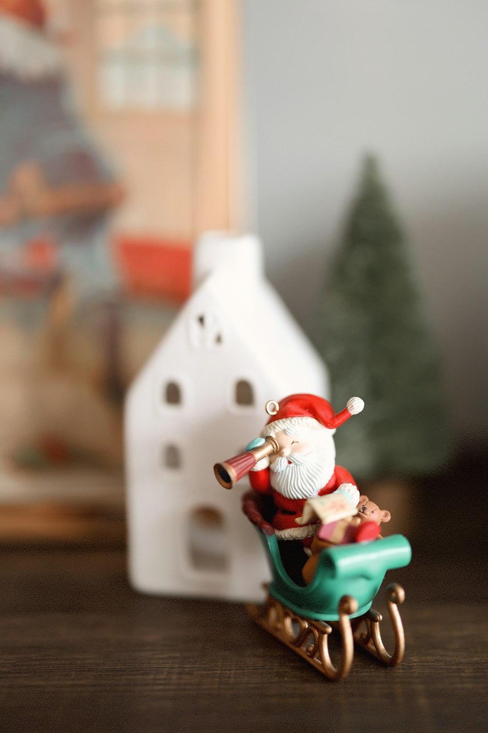 a figurine of a santa clause riding a sleigh