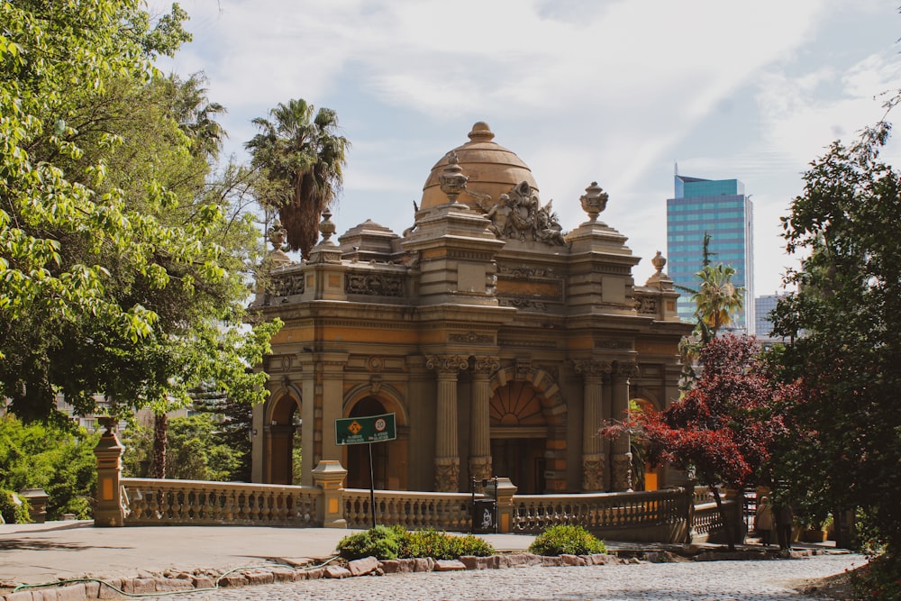 a large building with a fountain in front of it