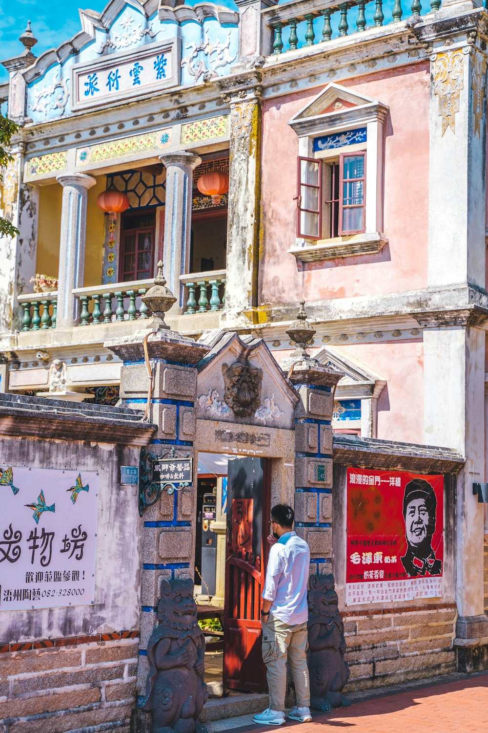 a man standing in front of a building