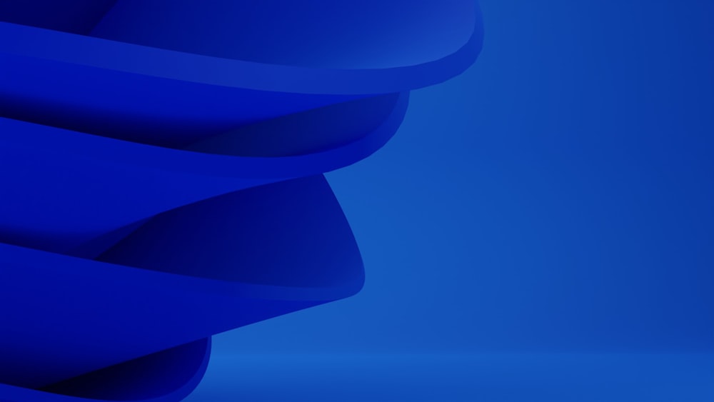 a blue abstract background with curved shapes