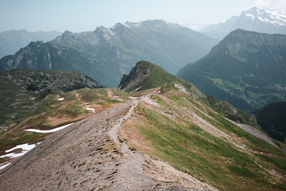 a dirt road in the middle of a mountain range