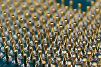 Close-up of high-quality electrical connectors arranged neatly on a dark surface with gold accents.