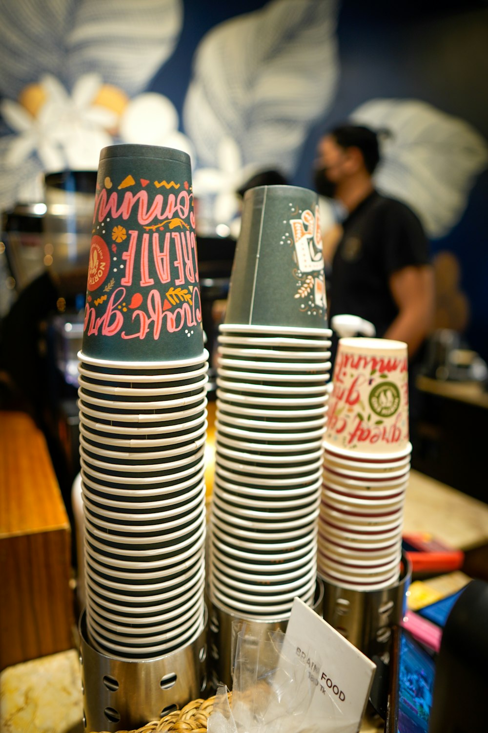 a stack of coffee cups sitting on top of a counter