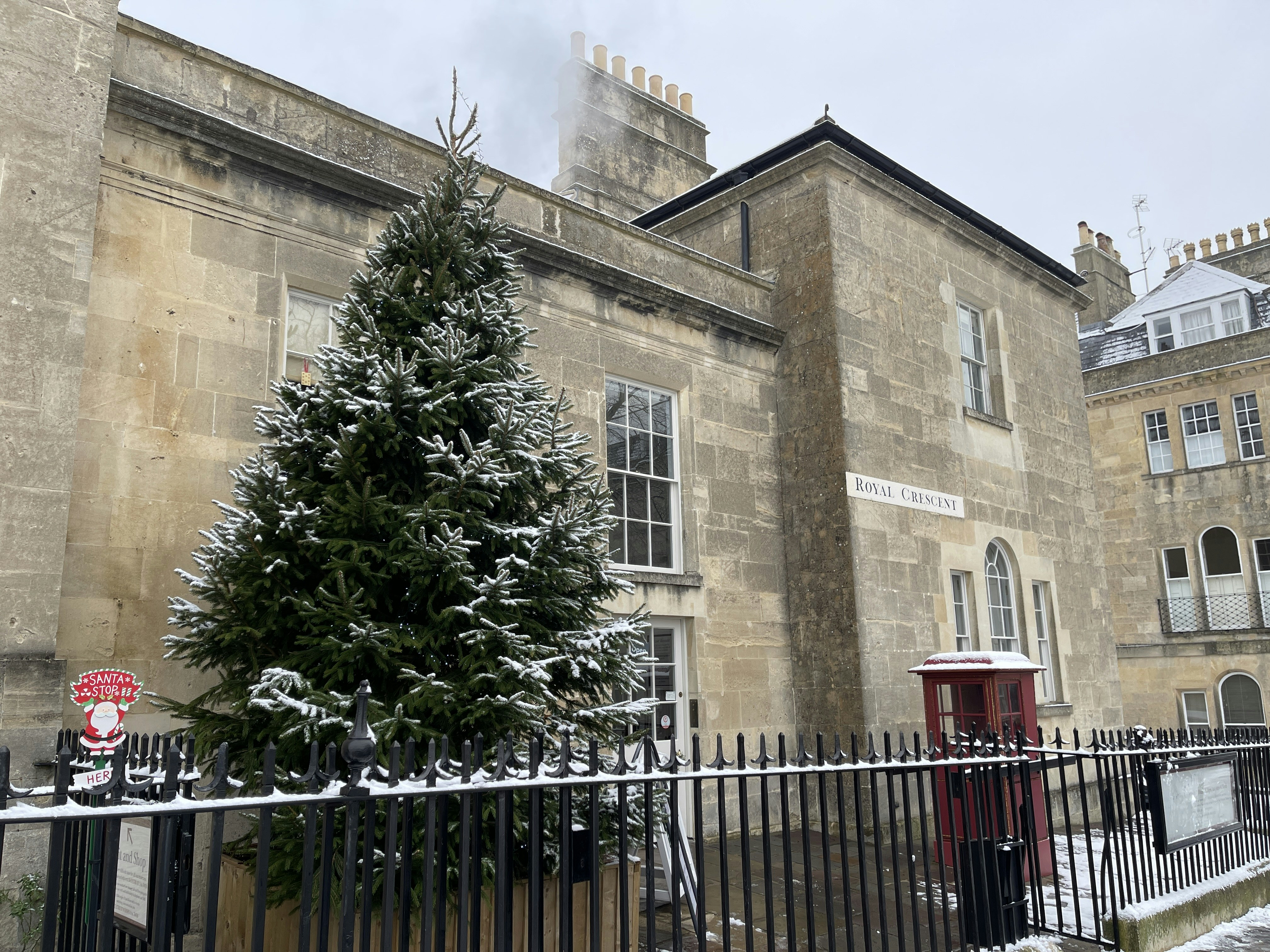 a large building with a tree in front of it