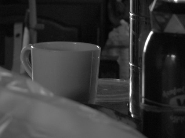 Close-up of a sleek mug from the curated product collection in monochrome tones.