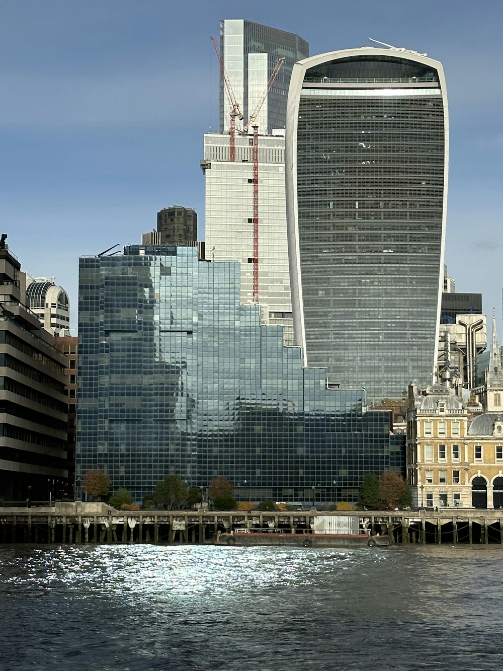 a very tall building next to a body of water